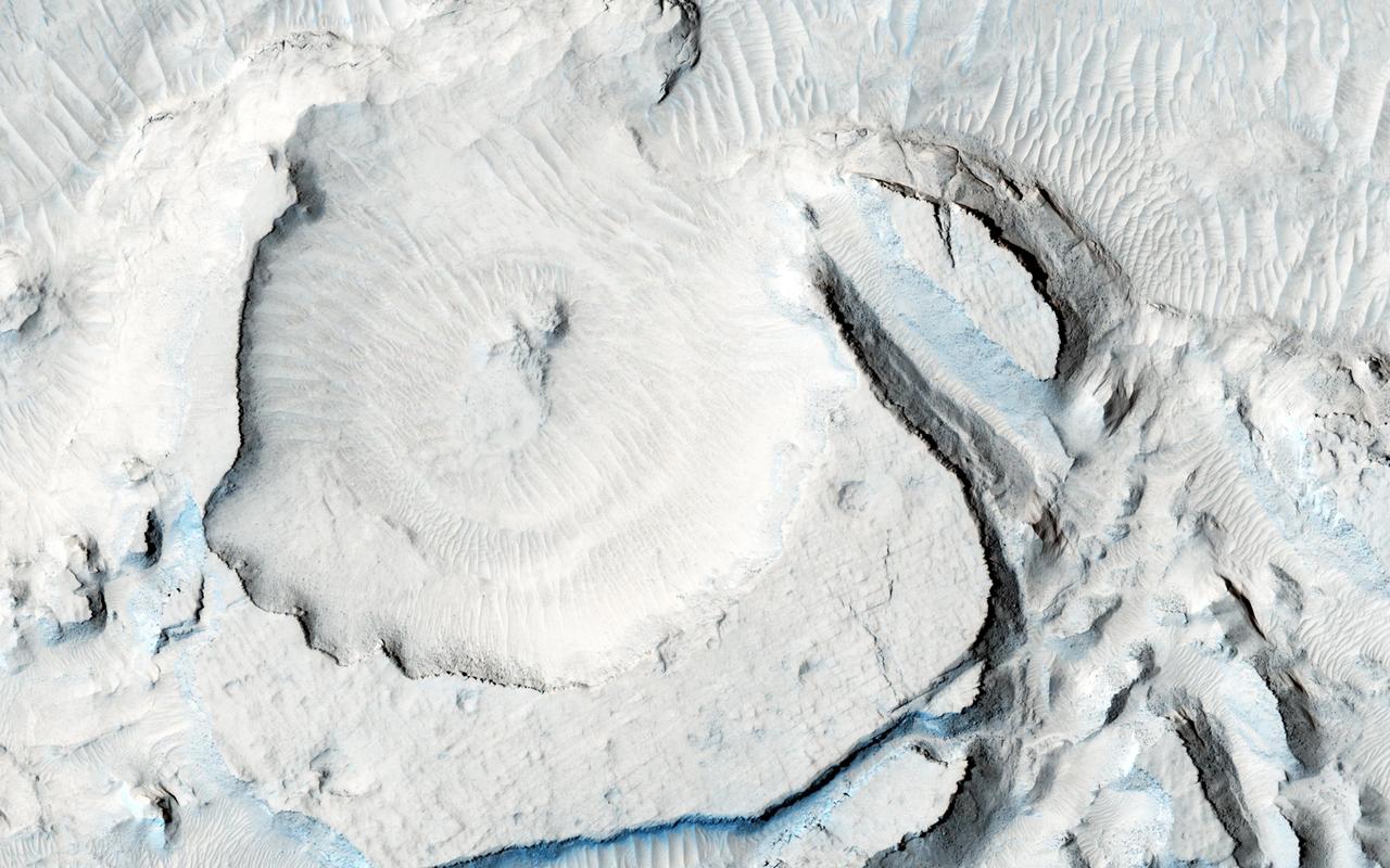 NASA Mars Reconnaissance Orbiter spacecraft captured these rounded, mysterious mounds occur along the floor of a depression in northern Arabia Terra.