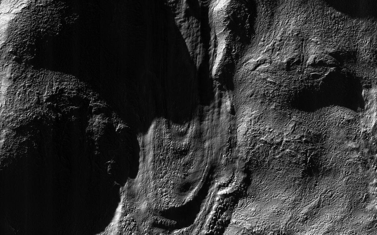 This image from NASA Mars Reconnaissance Orbiter spacecraft was acquired near the Martian winter solstice, when the sun was low over the horizon at this location.