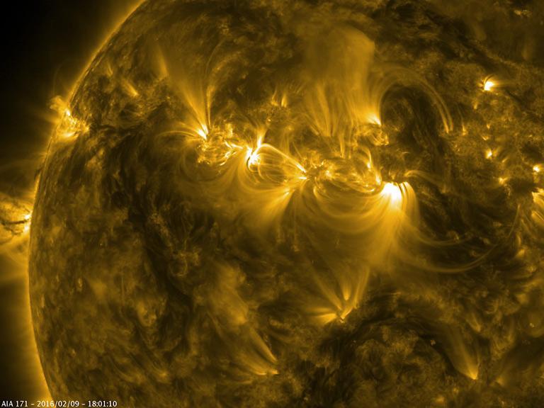 The magnetic field lines of three active regions in close proximity to one another interacted with each other over two and a half days Feb. 8-10, 2016. This image is from NASA Solar Dynamics Observatory.