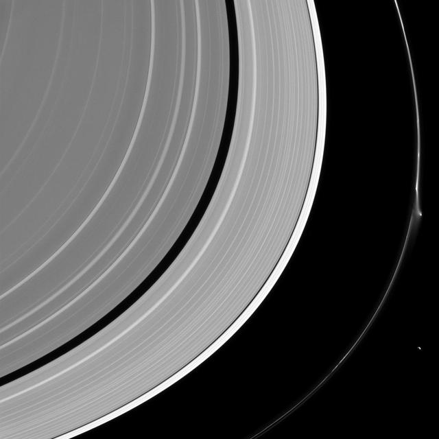 A bright disruption in Saturn's narrow F ring suggests it may have been disturbed recently. This feature was mostly likely not caused by Pandora (50 miles or 81 kilometers across) which lurks nearby, at lower right. More likely, it was created by the interaction of a small object embedded in the ring itself and material in the core of the ring. Scientists sometimes refer to these features as "jets." Because these bodies are small and embedded in the F ring itself, they are difficult to spot at the resolution available to NASA's Cassini spacecraft. Instead, their handiwork reveals their presence, and scientists use the Cassini spacecraft to study these stealthy sculptors of the F ring. This view looks toward the sunlit side of the rings from about 15 degrees above the ring plane. The image was taken in visible light with the Cassini spacecraft narrow-angle camera on April 8, 2016. The view was acquired at a distance of approximately 1.4 million miles (2.2 million kilometers) from Saturn and at a Sun-Saturn-spacecraft, or phase, angle of 105 degrees. Image scale is 8 miles (13 kilometers) per pixel. http://photojournal.jpl.nasa.gov/catalog/PIA20485