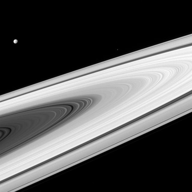 Saturn's main rings, along with its moons, are much brighter than most stars. As a result, much shorter exposure times (10 milliseconds, in this case) are required to produce an image and not saturate the detectors of the imaging cameras on NASA's Cassini spacecraft. A longer exposure would be required to capture the stars as well. Cassini has captured stars on many occasions, especially when a target moon is in eclipse, and thus darker than normal. For example, see PIA10526 . Dione (698 miles, 1123 kilometers across) and Epimetheus (70 miles, 113 kilometers across) are seen in this view, above the rings at left and right respectively. This image looks toward the sunlit side of the rings from about 3 degrees above the ring plane. The image was taken in visible light with the Cassini spacecraft wide-angle camera on April 2, 2016. The view was obtained at a distance of approximately 257,000 miles (413,000 kilometers) from Saturn and at a Sun-Saturn-spacecraft. http://photojournal.jpl.nasa.gov/catalog/PIA20489