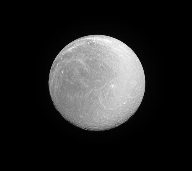 Rhea, like many moons in the outer solar system, appears dazzlingly bright in full sunlight. This is the signature of the water ice that forms most of the moon's surface.  Rhea (949 miles or 1,527 kilometers across) is Saturn's second largest moon after Titan. Its ancient surface is one of the most heavily cratered of all of Saturn's moons. Subtle albedo variations across the disk of Rhea hint at past geologic activity.  This view looks toward the anti-Saturn hemisphere of Rhea. North on Rhea is up and rotated 36 degrees to the right. The image was taken with the Cassini spacecraft narrow-angle camera on June 3, 2016 using a spectral filter which preferentially admits wavelengths of ultraviolet light centered at 338 nanometers.   http://photojournal.jpl.nasa.gov/catalog/PIA20495
