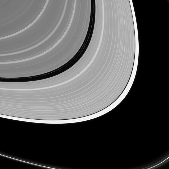 Pan may be small as satellites go, but like many of Saturn's ring moons, it has a has a very visible effect on the rings.  Pan (17 miles or 28 kilometers across, left of center) holds open the Encke gap and shapes the ever-changing ringlets within the gap (some of which can be seen here). In addition to raising waves in the A and B rings, other moons help shape the F ring, the outer edge of the A ring and open the Keeler gap.  This view looks toward the sunlit side of the rings from about 8 degrees above the ring plane. The image was taken in visible light with the Cassini spacecraft narrow-angle camera on July 2, 2016.  The view was acquired at a distance of approximately 840,000 miles (1.4 million kilometers) from Saturn and at a sun-Saturn-spacecraft, or phase, angle of 128 degrees. Image scale is 5 miles (8 kilometers) per pixel. Pan has been brightened by a factor of two to enhance its visibility.  http://photojournal.jpl.nasa.gov/catalog/PIA20499