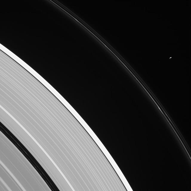 Pandora is seen here, in isolation beside Saturn's kinked and constantly changing F ring. Pandora (near upper right) is 50 miles (81 kilometers) wide. The moon has an elongated, potato-like shape (see PIA07632). Two faint ringlets are visible within the Encke Gap, near lower left. The gap is about 202 miles (325 kilometers) wide. The much narrower Keeler Gap, which lies outside the Encke Gap, is maintained by the diminutive moon Daphnis (not seen here). This view looks toward the sunlit side of the rings from about 23 degrees above the ring plane. The image was taken in visible light with the Cassini spacecraft narrow-angle camera on Aug. 12, 2016. The view was acquired at a distance of approximately 907,000 miles (1.46 million kilometers) from Saturn and at a Sun-Saturn-spacecraft, or phase, angle of 113 degrees. Image scale is 6 miles (9 kilometers) per pixel. http://photojournal.jpl.nasa.gov/catalog/PIA20504