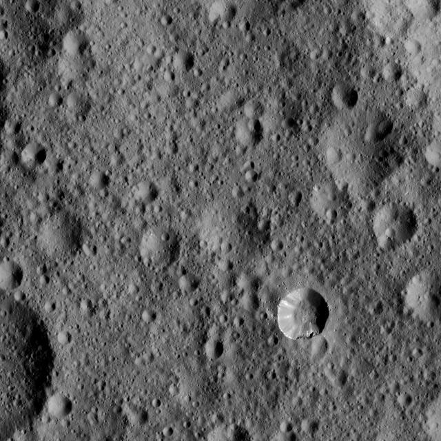 This view from NASA's Dawn spacecraft shows cratered terrain typical of Ceres, with a small bright crater highlighting the scene at lower right.  The view is centered at approximately 37 degrees north latitude, 349 degrees east longitude.  Dawn acquired this image on Feb. 9, 2016, from its low-altitude mapping orbit, at a distance of about 240 miles (385 kilometers) from the surface. The image resolution is 120 feet (35 meters) per pixel.  http://photojournal.jpl.nasa.gov/catalog/PIA20556