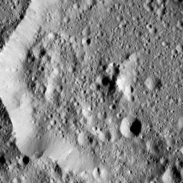 Ernutet Crater is featured in this image from Ceres, taken by NASA Dawn spacecraft. Ernutet was named for the Egyptian cobra-headed goddess of the harvest. The crater measures about 32 miles 52 kilometers in diameter and is located in the northern hem