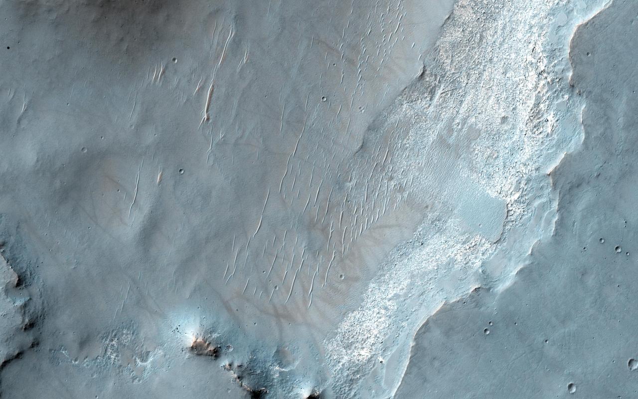 This image from NASA Mars Reconnaissance Orbiter spacecraft shows an exposure of bedrock on the floor of Bakhuysen Crater, an impact crater in Noachis Terra. The bedrock is highly fragmented and fractured.