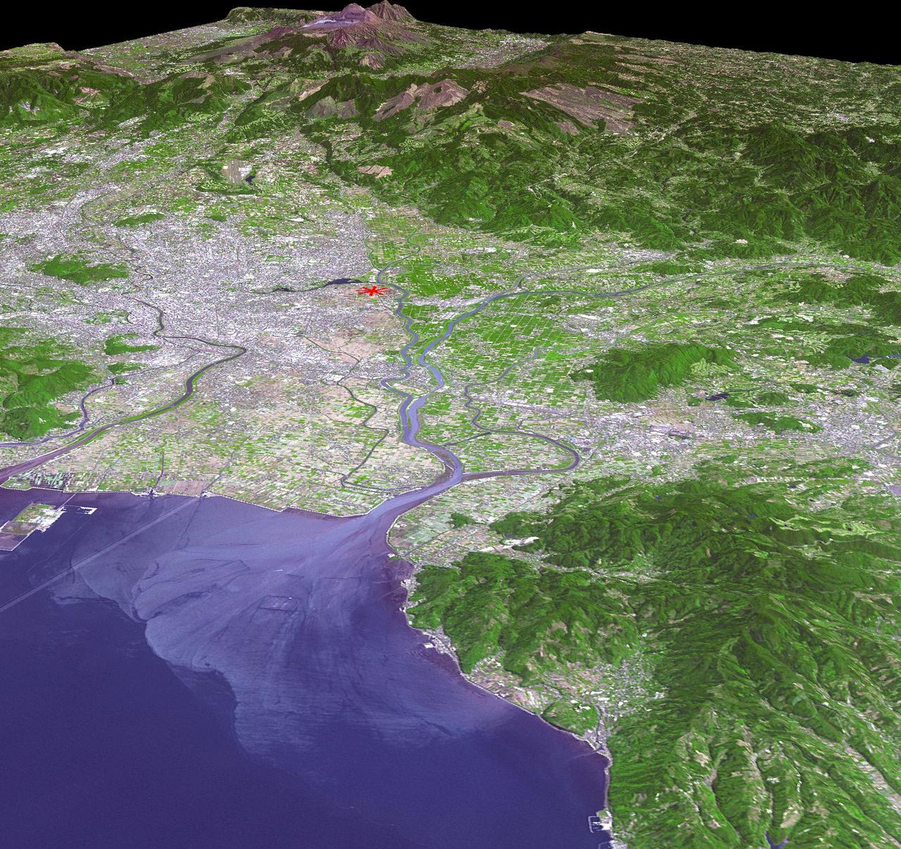 This image from NASA Terra spacecraft shows a perspective view, looking toward the Aso volcanic caldera, which indicates the epicenter with a red star.