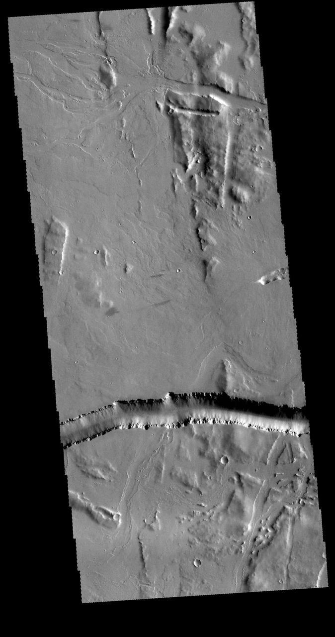 This image captured by NASA 2001 Mars Odyssey spacecraft shows part of Olympica Fossae.
