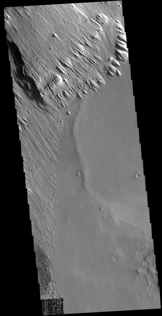 This image captured by NASA 2001 Mars Odyssey spacecraft is located near Memnonia Sulci, on the edge of Lucus Planum.