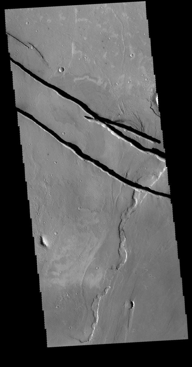 This image captured by NASA 2001 Mars Odyssey spacecraft shows a portion of Cerberus Fossae.