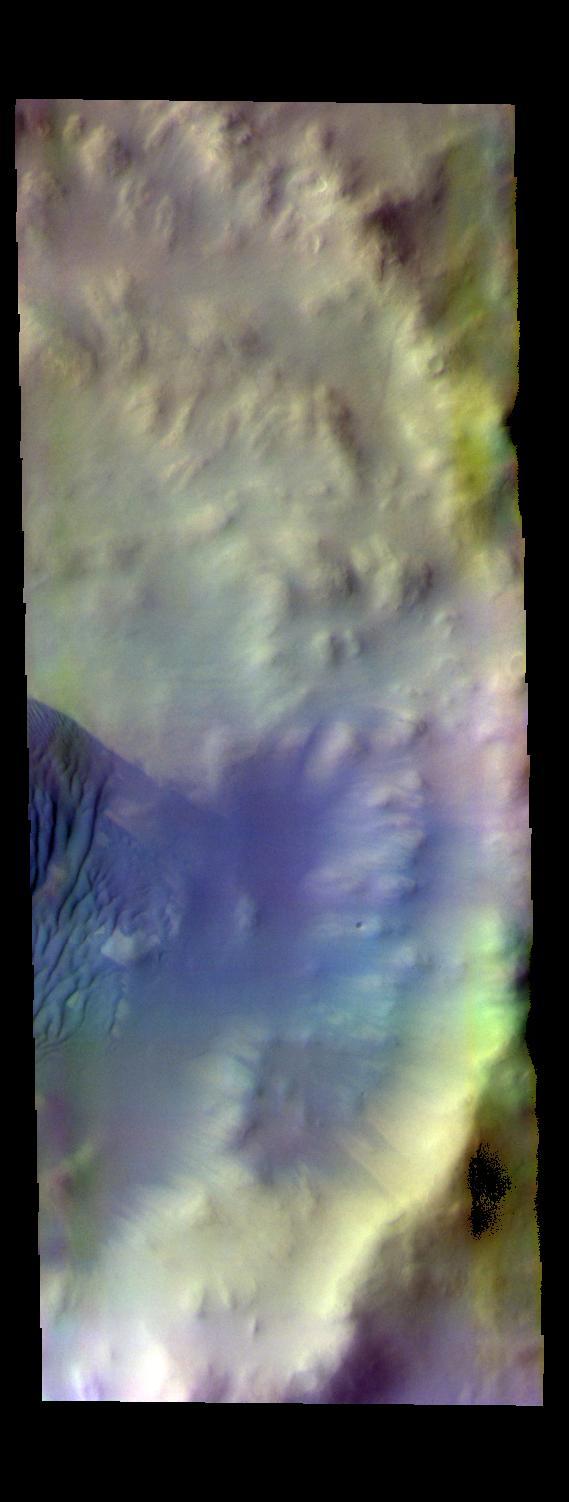 The THEMIS camera contains 5 filters. The data from different filters can be combined in multiple ways to create a false color image. This image from NASA 2001 Mars Odyssey spacecraft shows some of the dunes on the floor of Wegener Crater.