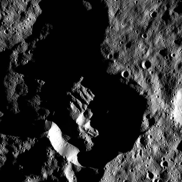 This image from NASA Dawn spacecraft shows Attis Crater on Ceres, which measures 14 miles 22 kilometers in diameter. The long shadows in and around the crater reflect Attis far-southern location.