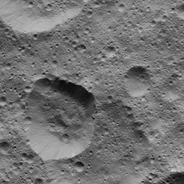 This picture from NASA Dawn spacecraft shows craters in the northern hemisphere of Ceres. The large crater at lower left displays several bright streaks on its walls.