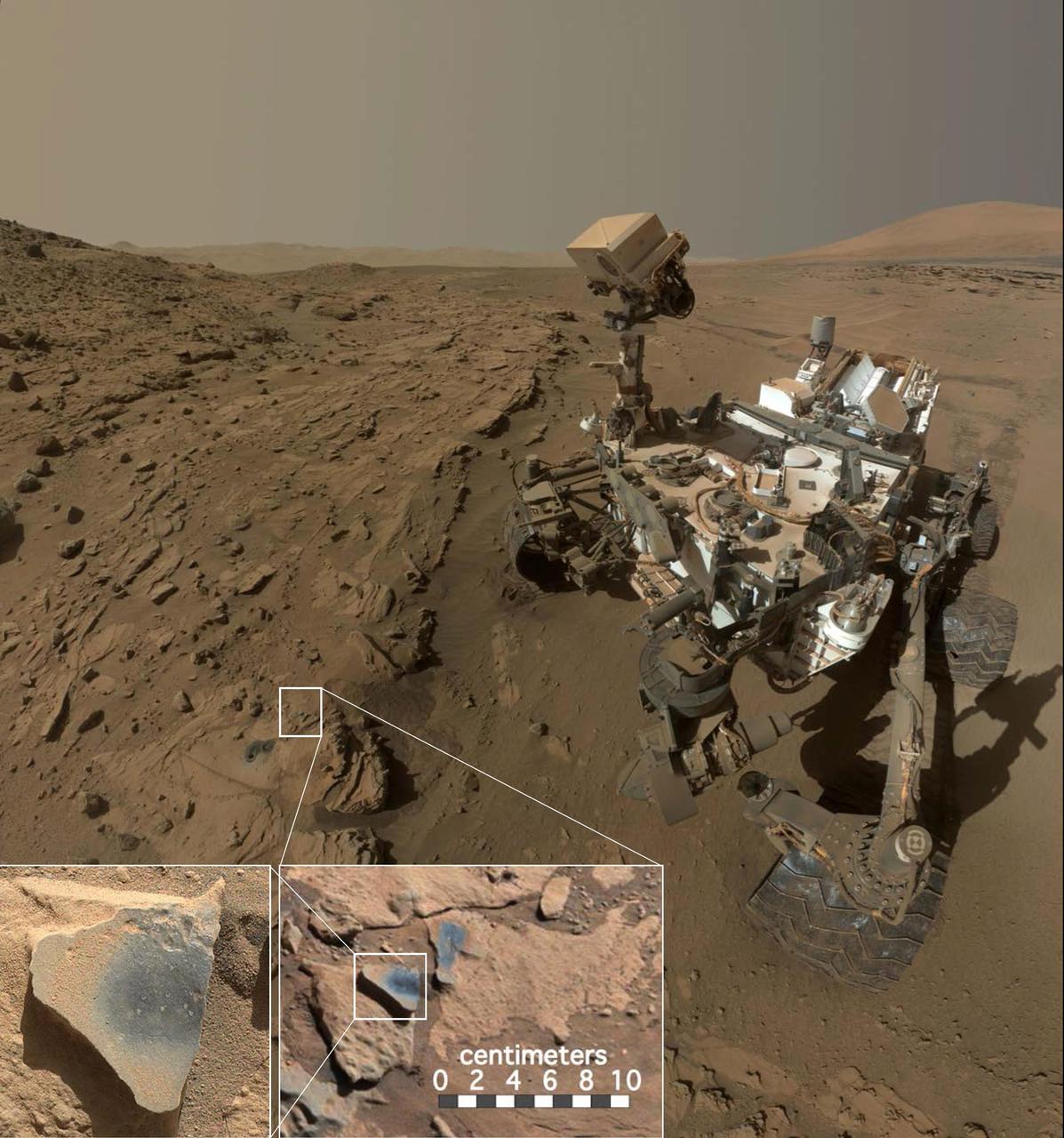 This scene shows NASA's Curiosity Mars rover at a location called "Windjana," where the rover found rocks containing manganese-oxide minerals, which require abundant water and strongly oxidizing conditions to form.  In front of the rover are two holes from the rover's sample-collection drill and several dark-toned features that have been cleared of dust (see inset images). These flat features are erosion-resistant fracture fills containing manganese oxides. The discovery of these materials suggests the Martian atmosphere might once have contained higher abundances of free oxygen than it does now.  The rover used the Mars Hand Lens Imager (MAHLI) camera in April and May 2014 to take dozens of images that were combined into this self-portrait.  http://photojournal.jpl.nasa.gov/catalog/PIA20752