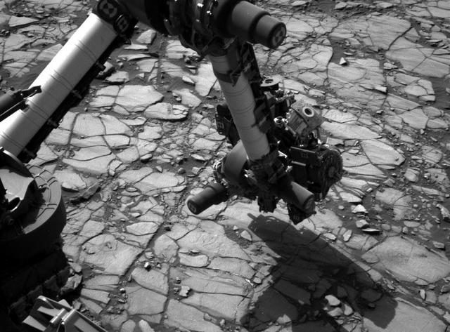 NASA's Curiosity Mars rover began close-up investigation of a target called "Marimba," on lower Mount Sharp, during the week preceding the fourth anniversary of the mission's dramatic sky-crane landing.  The Navigation Camera (Navcam) on Curiosity's mast took this image on Aug. 2, 2016, during the 1,418th Martian day, or sol, since Curiosity landed inside Gale Crater on Aug. 6, 2012, Universal Time (Aug. 5, PDT). In this scene, the rover has extended its arm over a patch of bedrock selected as the target for rover's next drilling operation. The drilling collects rock powder for onboard laboratory analysis. The arm is positioned with the rover's wire-bristle Dust Removal Tool above the target.  http://photojournal.jpl.nasa.gov/catalog/PIA20764