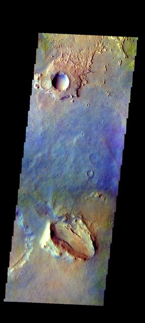 The THEMIS camera contains 5 filters. The data from different filters can be combined in multiple ways to create a false color image. This image from NASA 2001 Mars Odyssey spacecraft shows part of the plains in Arabia Terra. Orbit Number: 39336 Latitude: 5.66281 Longitude: 358.159 Instrument: VIS Captured: 2010-10-27 06:39 http://photojournal.jpl.nasa.gov/catalog/PIA20770