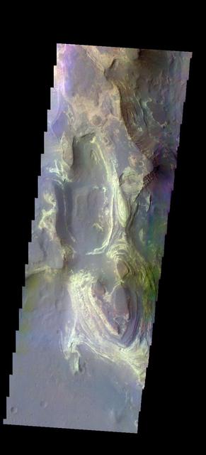 The THEMIS camera contains 5 filters. The data from different filters can be combined in multiple ways to create a false color image. These false color images may reveal subtle variations of the surface not easily identified in a single band image. Today's false color image shows the northern part of Terby Crater. This image shows the layered deposits that fill the crater.  Orbit Number: 42741 Latitude: -27.348 Longitude: 74.2507 Instrument: VIS Captured: 2011-08-03 13:23  http://photojournal.jpl.nasa.gov/catalog/PIA20795