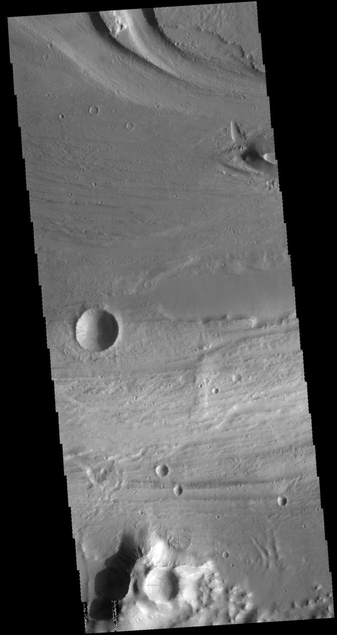 This VIS image shows a portion of Kasei Valles. Kasei Valles is a large channel system that drained from the Tharsis volcanic highlands to the lower elevation Chryse Plainitia. At the top of the image is a deeper section of the channel with a tear-drop shaped central island. The direction of fluid flow is identified by the shape of the island, with the narrow "tail" on the down hill end. Orbit Number: 64185 Latitude: 26.0042 Longitude: 289.472 Instrument: VIS Captured: 2016-06-02 19:34 http://photojournal.jpl.nasa.gov/catalog/PIA20798
