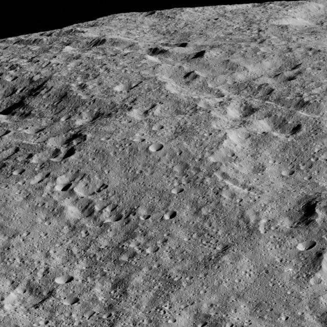 This image shows the limb of Ceres from above an equatorial region east of Kirnis Crater. The scene is centered at approximately 10 degrees north latitude, 284 degrees east longitude. NASA's Dawn spacecraft took this image on June 13, 2016, from its low-altitude mapping orbit, at a distance of about 240 miles (385 kilometers) above the surface. The image resolution is 120 feet (35 meters) per pixel. http://photojournal.jpl.nasa.gov/catalog/PIA20825