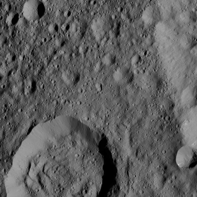 Liber Crater is featured at lower left in this image from Ceres. Named for the Roman god of agriculture, Liber is 14 miles 23 kilometers. NASA's Dawn spacecraft took this image on June 16, 2016, from its low-altitude mapping orbit, at a distance of about 240 miles (385 kilometers) above the surface. The image resolution is 120 feet (35 meters) per pixel. http://photojournal.jpl.nasa.gov/catalog/PIA20834
