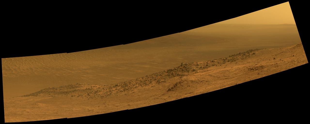 This scene from NASA's Mars Exploration Rover Opportunity shows "Wharton Ridge," which forms part of the southern wall of "Marathon Valley" on the western rim of Endeavour Crater.  The full extent of Wharton Ridge is visible, with the floor of Endeavour Crater beyond it and the far wall of the crater in the distant background. Near the right edge of the scene is "Lewis and Clark Gap," through which Opportunity crossed from Marathon Valley to "Bitterroot Valley" in September 2016.  Before the rover departed Marathon Valley, its panoramic camera (Pancam) acquired the component images for this scene on Aug. 30, 2016, during the 4,480th Martian day, or sol, of Opportunity's work on Mars.  Opportunity's science team chose the ridge's name to honor the memory of Robert A. Wharton (1951-2012), an astrobiologist who was a pioneer in the use of terrestrial analog environments, particularly in Antarctica, to study scientific problems connected to the habitability of Mars. Over the course of his career, he was a visiting senior scientist at NASA Headquarters, vice president for research at the Desert Research Institute, provost at Idaho State University, and president of the South Dakota School of Mines and Technology.  The view spans from east-northeast at left to southeast at right. It merges exposures taken through three of the Pancam's color filters, centered on wavelengths of 753 nanometers (near-infrared), 535 nanometers (green) and 432 nanometers (violet). It is presented in approximately true color.  http://photojournal.jpl.nasa.gov/catalog/PIA20849