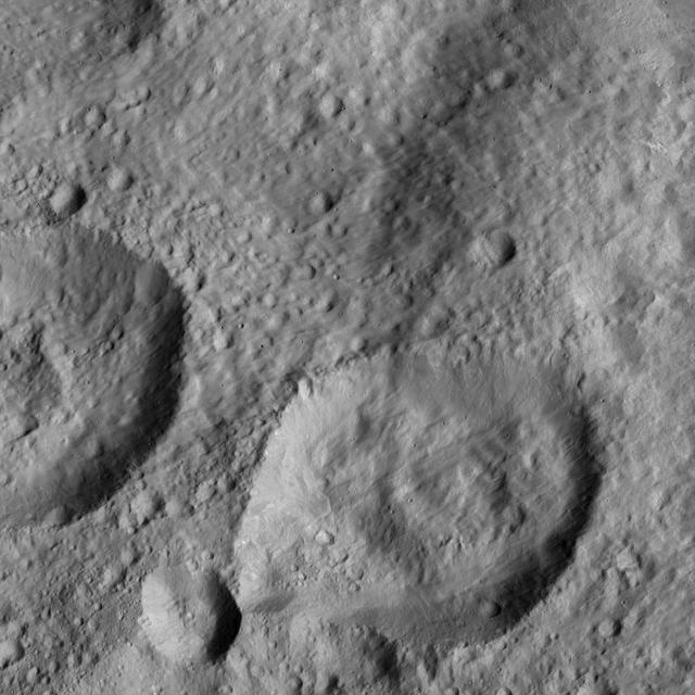 NASA's Dawn spacecraft spied this relatively smooth area of Ceres' surface, which includes the feature named Dalien Tholus -- a dome-shaped feature visible in top right quadrant of the image. The image is centered at approximately 2.5 degrees north latitude, 4.3 degrees east longitude. Dawn took this image on May 28, 2016, from its low-altitude mapping orbit, at a distance of about 240 miles (385 kilometers) above the surface. The image resolution is 120 feet (35 meters) per pixel. http://photojournal.jpl.nasa.gov/catalog/PIA20878