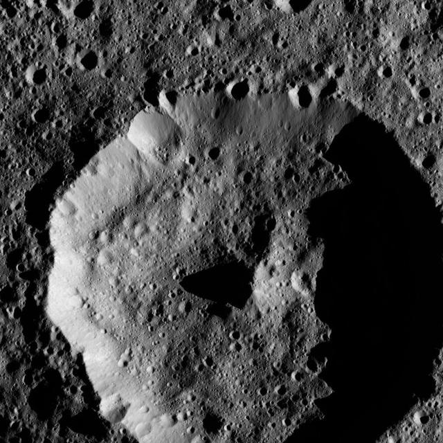 The cone-shaped central peak of a Cerean crater casts a long shadow in this view from NASA Dawn spacecraft taken on May 28, 2016 from its low-altitude mapping orbit above Ceres at a distance of about 240 miles 385 kilometers above the surface. Dawn took this image on May 28, 2016, from its low-altitude mapping orbit above Ceres, at a distance of about 240 miles (385 kilometers) above the surface. The image resolution is 120 feet (35 meters) per pixel. http://photojournal.jpl.nasa.gov/catalog/PIA20879