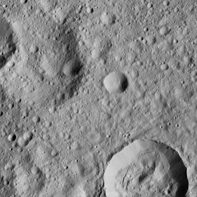 This view from NASA's Dawn spacecraft shows cratered terrain on Ceres, centered at 10 degrees south latitude, 197 degrees east longitude.  Dawn took this image on June 1, 2016, from its low-altitude mapping orbit, at a distance of about 240 miles (385 kilometers) above the surface. The image resolution is 120 feet (35 meters) per pixel.  http://photojournal.jpl.nasa.gov/catalog/PIA20931
