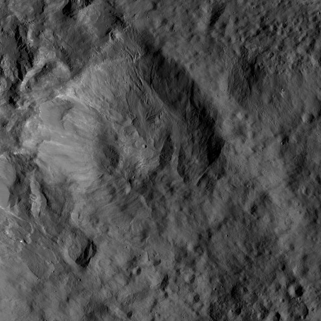 This view from NASA's Dawn spacecraft shows an older crater on Ceres that is smoothly blanketed by ejecta from the nearby, relatively young crater named Kupalo. The image is centered at 38 degrees south latitude, 178 degrees east longitude. Dawn took this image on June 1, 2016, from its low-altitude mapping orbit, at a distance of about 240 miles (385 kilometers) above the surface. The image resolution is 120 feet (35 meters) per pixel. http://photojournal.jpl.nasa.gov/catalog/PIA20932