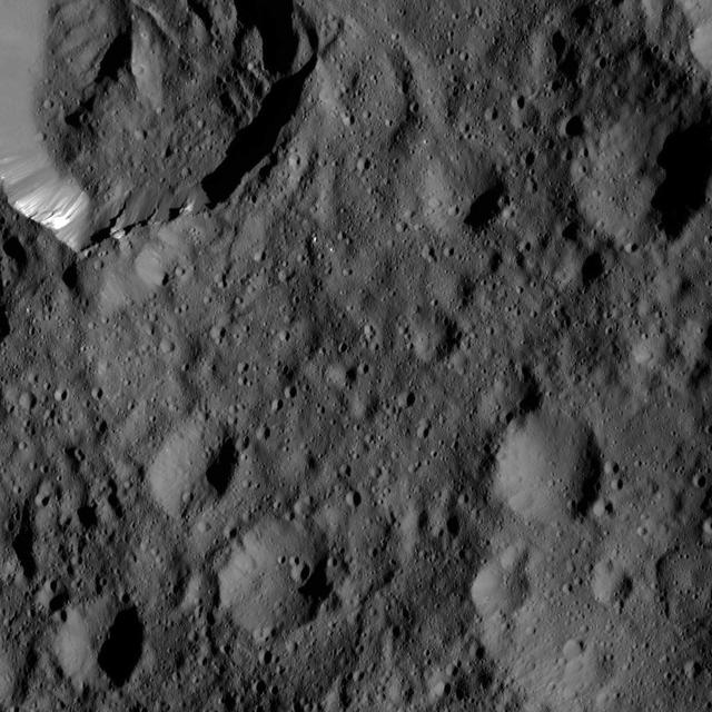 This view from NASA's Dawn spacecraft shows an older crater on Ceres that is smoothly blanketed by ejecta from the nearby, relatively young crater named Kupalo. The image is centered at 38 degrees south latitude, 178 degrees east longitude. Dawn took this image on June 1, 2016, from its low-altitude mapping orbit, at a distance of about 240 miles (385 kilometers) above the surface. The image resolution is 120 feet (35 meters) per pixel. http://photojournal.jpl.nasa.gov/catalog/PIA20932