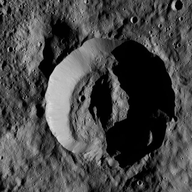 NASA's Dawn spacecraft obtained this view of Laukumate Crater (19 miles, 30 kilometers wide) on Ceres on June 2, 2016. Laukumate is named for a Latvian goddess of agriculture.  Dawn took this image from its low-altitude mapping orbit, at a distance of about 240 miles (385 kilometers) above the surface. The image resolution is 120 feet (35 meters) per pixel.  http://photojournal.jpl.nasa.gov/catalog/PIA20937