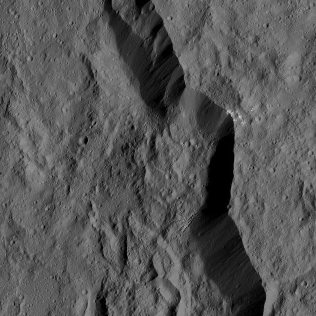 The rim of Dantu Crater (78 miles, 125 kilometers wide) is seen in this view of Ceres from NASA's Dawn spacecraft.  Dawn took this image on June 2, 2016, from its low-altitude mapping orbit, at a distance of about 240 miles (385 kilometers) above the surface. The image resolution is 120 feet (35 meters) per pixel.  http://photojournal.jpl.nasa.gov/catalog/PIA20938