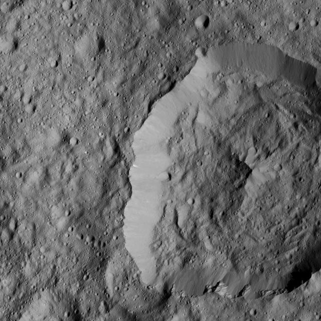 NASA's Dawn spacecraft views Abellio Crater (20 miles, 32 kilometers wide) on Ceres in this image.  Dawn took this image on June 2, 2016, from its low-altitude mapping orbit, at a distance of about 240 miles (385 kilometers) above the surface. The image resolution is 120 feet (35 meters) per pixel.  http://photojournal.jpl.nasa.gov/catalog/PIA20940