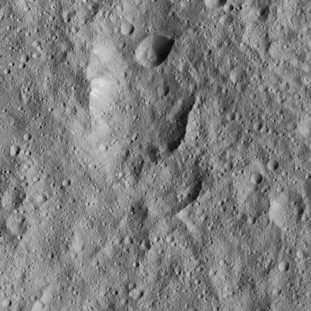 This image from NASA's Dawn spacecraft shows cratered terrain to the west of Ahuna Mons. In this area there are chains of craters called Uhola Catenae. The image is centered at 7 degrees south latitude, 304 degrees east longitude. Dawn took this image on June 13, 2016, from its low-altitude mapping orbit, at a distance of about 240 miles (385 kilometers) above the surface. The image resolution is 120 feet (35 meters) per pixel. http://photojournal.jpl.nasa.gov/catalog/PIA20967