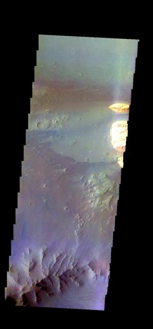 The THEMIS camera contains 5 filters. The data from different filters can be combined in multiple ways to create a false color image. These false color images may reveal subtle variations of the surface not easily identified in a single band image. Today's false color image shows part of Ganges Chasma. Orbit Number: 43282 Latitude: -8.53126 Longitude: 313.149 Instrument: VIS Captured: 2011-09-17 02:06 http://photojournal.jpl.nasa.gov/catalog/PIA20983