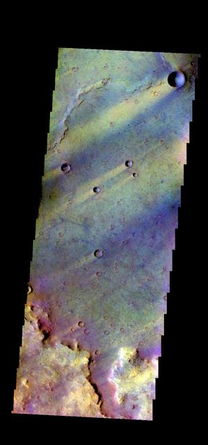 The THEMIS camera contains 5 filters. The data from different filters can be combined in multiple ways to create a false color image. This image from NASA 2001 Mars Odyssey spacecraft shows part of Syrtis Major Planum.
