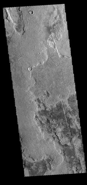 This VIS image shows some of the extensive lava flows that comprise Solis Planum. Orbit Number: 64810 Latitude: -20.2434 Longitude: 258.499 Instrument: VIS Captured: 2016-07-24 06:51 http://photojournal.jpl.nasa.gov/catalog/PIA20991