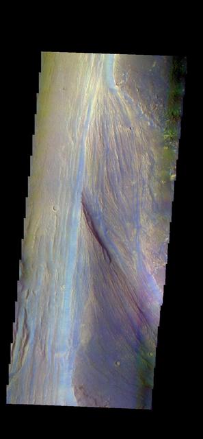 The THEMIS VIS camera contains 5 filters. The data from different filters can be combined in multiple ways to create a false color image. These false color images may reveal subtle variations of the surface not easily identified in a single band image. Today's false color image shows part of Lobo Vallis, which is part of the larger Kasei Valles. The dark blue material is most likely basaltic sand. Orbit Number: 43756 Latitude: 27.9304 Longitude: 299.541 Instrument: VIS Captured: 2011-10-26 04:14 http://photojournal.jpl.nasa.gov/catalog/PIA21015