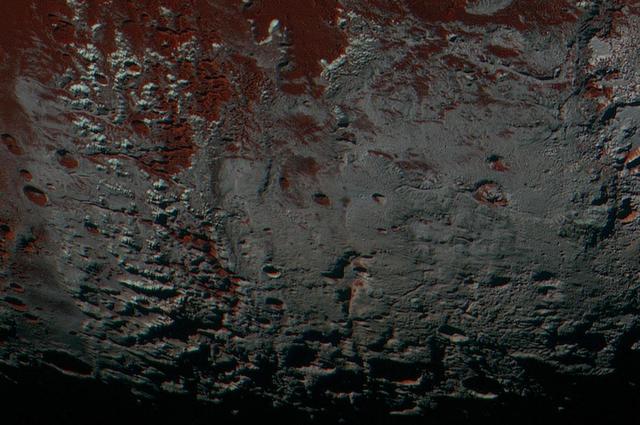 NASA image: Pluto Methane Snowcaps on the Edge of Darkness