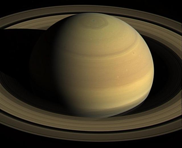 NASA's Cassini spacecraft stared at Saturn for nearly 44 hours on April 25 to 27, 2016, to obtain this movie showing just over four Saturn days.  With Cassini's orbit being moved closer to the planet in preparation for the mission's 2017 finale, scientists took this final opportunity to capture a long movie in which the planet's full disk fit into a single wide-angle camera frame.  Visible at top is the giant hexagon-shaped jet stream that surrounds the planet's north pole. Each side of this huge shape is slightly wider than Earth.  The resolution of the 250 natural color wide-angle camera frames comprising this movie is 512x512 pixels, rather than the camera's full resolution of 1024x1024 pixels. Cassini's imaging cameras have the ability to take reduced-size images like these in order to decrease the amount of data storage space required for an observation.  The spacecraft began acquiring this sequence of images just after it obtained the images to make a three-panel color mosaic.  When it began taking images for this movie sequence, Cassini was 1,847,000 miles (2,973,000 kilometers) from Saturn, with an image scale of 355 kilometers per pixel. When it finished gathering the images, the spacecraft had moved 171,000 miles (275,000 kilometers) closer to the planet, with an image scale of 200 miles (322 kilometers) per pixel.  A movie is available at http://photojournal.jpl.nasa.gov/catalog/PIA21047