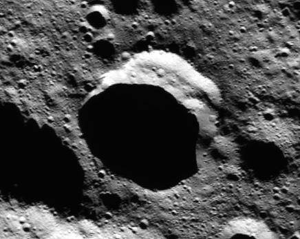 This frame from an animation made of images from NASA's Dawn spacecraft shows a crater in the northern polar region of Ceres that is partly in shadow year-round. In several craters like this one, bright water ice deposits have been observed by Dawn's framing camera.  This finding suggests that water ice can be stored for significant amounts of time in cold, dark craters on Ceres. Such reservoirs are called "cold traps." At less than minus 260 degrees Fahrenheit (110 Kelvin), they are so chilly that very little of the ice turns into vapor in the course of a billion years.  A movie is available at http://photojournal.jpl.nasa.gov/catalog/PIA21082