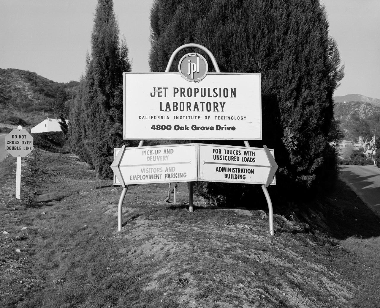 This archival image was released as part of a gallery comparing JPL’s past and present, commemorating the 80th anniversary of NASA’s Jet Propulsion Laboratory on Oct. 31, 2016.  This is what greeted visitors to the Jet Propulsion Laboratory in December 1957, before NASA was created and the lab became one of its centers. There is no sign at this location today -- there is just a stairway that runs up the side of the main Administration Building (Building 180). The official lab sign has moved farther south, just as the lab itself has expanded farther south out from the base of the San Gabriel Mountains.  http://photojournal.jpl.nasa.gov/catalog/PIA21115