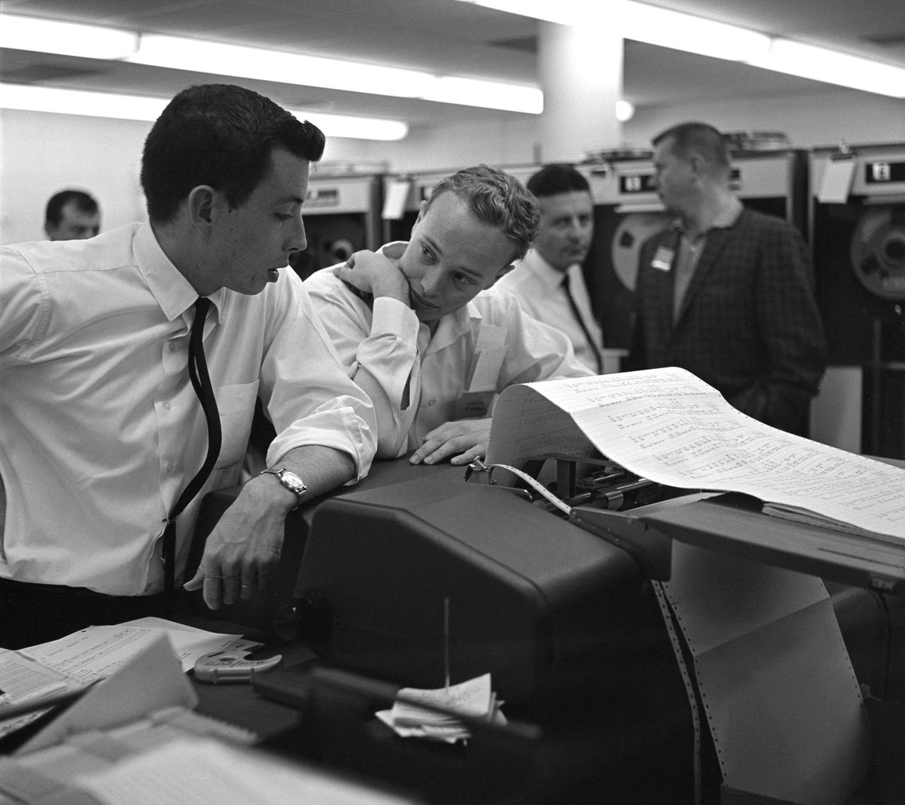 This archival image was released as part of a gallery comparing JPL's past and present, commemorating the 80th anniversary of NASA's Jet Propulsion Laboratory on Oct. 31, 2016.  This image shows engineers at NASA's Jet Propulsion Laboratory looking at data related to the Venus flyby of Mariner 2 on Dec. 14, 1962. This was the first successful flyby of another planet.  http://photojournal.jpl.nasa.gov/catalog/PIA21117