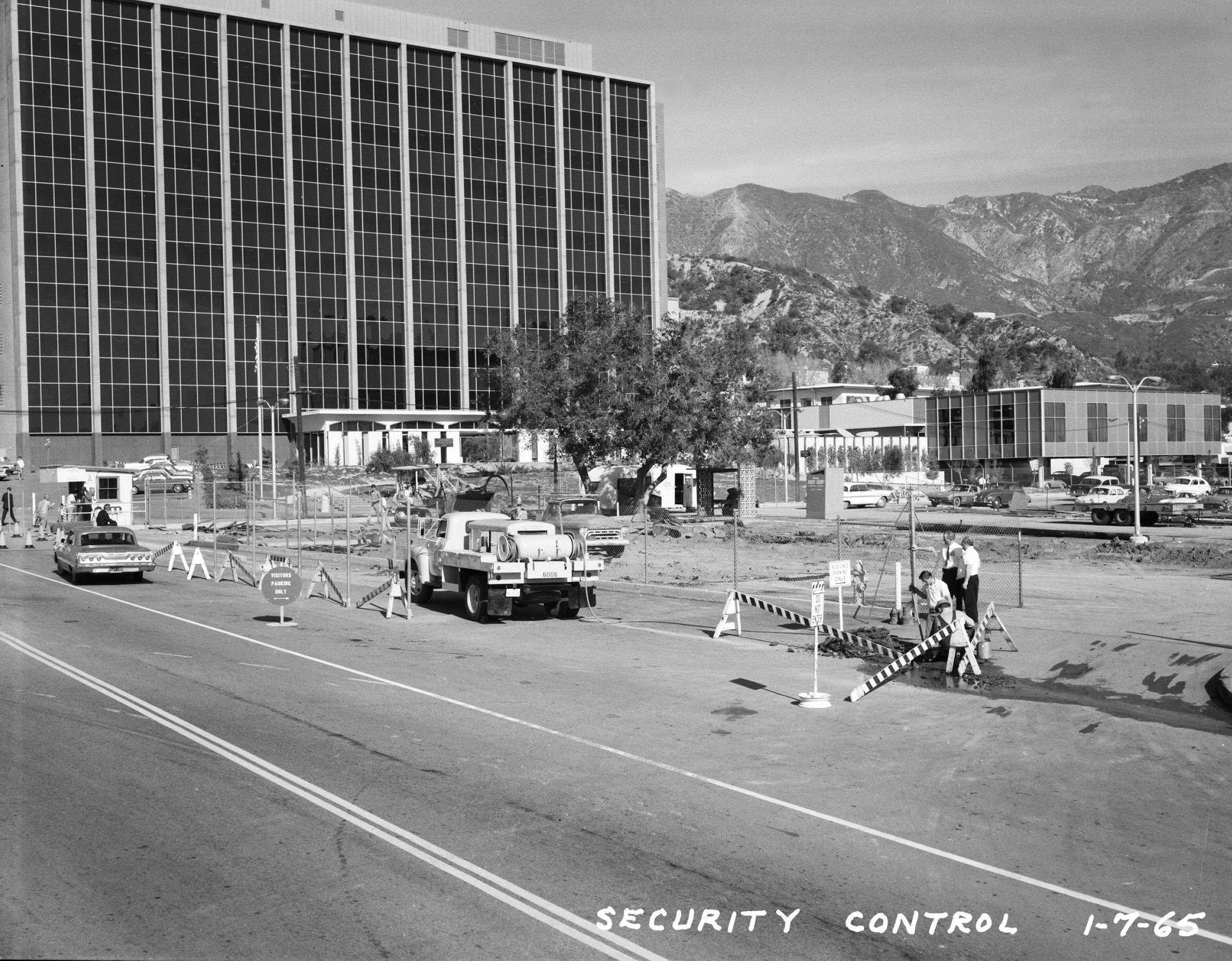 The Administration Building at the Jet Propulsion Laboratory is pictured as it appeared in 1965 with site construction going on in the foreground.
