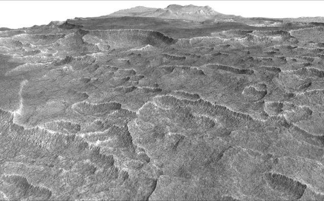 This vertically exaggerated view shows scalloped depressions in Mars Utopia Planitia region, prompting using ground-penetrating radar aboard NASA Mars Reconnaissance Orbiter to check for underground ice.