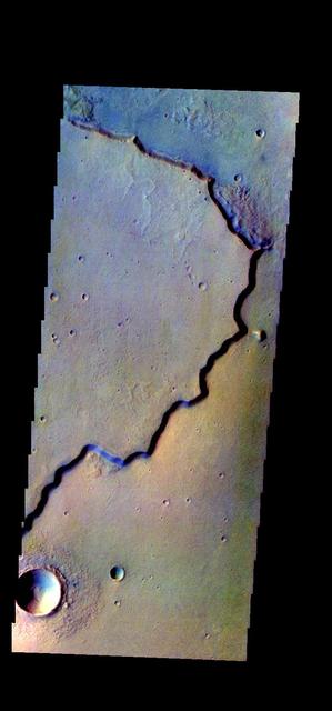 The THEMIS VIS camera contains 5 filters. The data from different filters can be combined in multiple ways to create a false color image. These false color images may reveal subtle variations of the surface not easily identified in a single band image. Today's false color image shows part of the margin of Chryse Planitia. Dark blue in this false color combination is mostly likely basaltic material/dunes. Orbit Number: 44280 Latitude: 33.0423 Longitude: 309.853 Instrument: VIS Captured: 2011-12-08 07:16 http://photojournal.jpl.nasa.gov/catalog/PIA21162