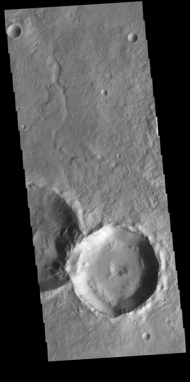 This image captured by NASA 2001 Mars Odyssey spacecraft is located in Noachis Terra. The unnamed crater at the bottom of the image contains a central pit. Central features such as pits and peaks can provide information about both the impacted surface and the size of the meteorite. Orbit Number: 65680 Latitude: -28.4965 Longitude: 349.805 Instrument: VIS Captured: 2016-10-03 22:49 http://photojournal.jpl.nasa.gov/catalog/PIA21180