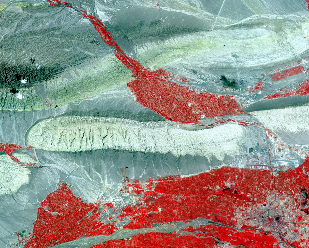 In far western China is Xinjiang Prefecture, with its capital of Kashgar (bottom right on image). The area has a rich history of over 2,000 years; Kashgar has served as a trading post and important city on the Silk Road. The folded sedimentary rocks outline valleys that contain oases, cultivated for thousands of years. The image was acquired 23 July 2014, covers an area of 37.3 by 46.3 kilometers, and is located at 39.8 degrees north, 75.8 degrees east.   http://photojournal.jpl.nasa.gov/catalog/PIA21189