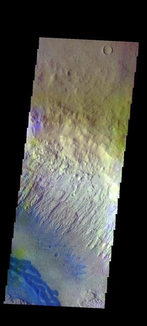 The THEMIS VIS camera contains 5 filters. The data from different filters can be combined in multiple ways to create a false color image. These false color images may reveal subtle variations of the surface not easily identified in a single band image. Today's false color image shows part of Danielson Crater. The dark blue feature at the bottom of the image are sand dunes on the floor of the crater. Orbit Number: 48086 Latitude: 8.33987 Longitude: 353.137 Instrument: VIS Captured: 2012-10-16 13:46 http://photojournal.jpl.nasa.gov/catalog/PIA21198